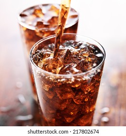 soft drink being poured into glass - Shutterstock ID 217802674