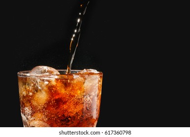 Soft Drink, Pouring A Soda Into A Glass On Black Background ,copy Space For Text 