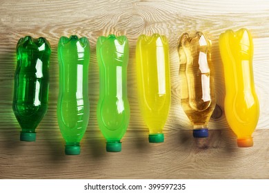 Soft Drinks Bottles On The Wooden Table, Top View