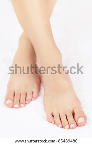 Soft female feet with pedicure close up