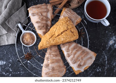 Soft and flaky homemade Scones with powdered sugar glaze on top - Powered by Shutterstock