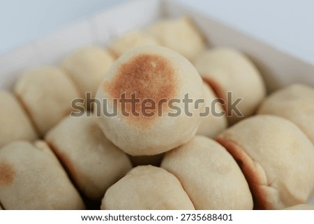 Soft fluffy dinner rolls in a box, freshly baked and ready to serve, perfect for breakfast, lunch, or cozy family meals that evoke comfort athome warm.
