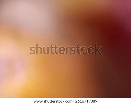 A soft focus abstract background featuring a warm gradient of blurred hues, including peach, amber, gold, rose, and hints of magenta and brown.