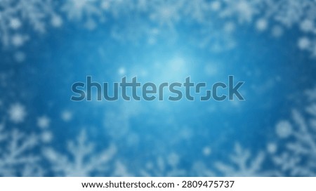 A soft focus abstract background featuring a blue gradient with sparkling lights and falling snowflakes, creating a wintery atmosphere.