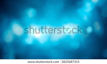 A soft focus abstract background featuring glowing blue bokeh lights, creating a dreamy and ethereal atmosphere.