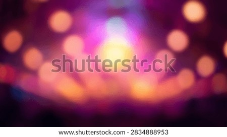 A soft focus abstract background featuring numerous blurred circles of light in warm, vibrant colors like pink, purple, and orange.