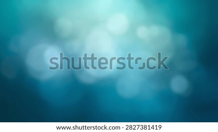 A soft focus abstract background with glowing bokeh lights in shades of blue and teal, creating a serene and dreamy atmosphere.