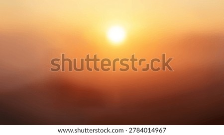 A soft focus abstract background shows a glowing sun disk surrounded by a hazy golden orange atmosphere in a warm and ethereal photographic style.