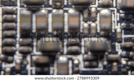 Soft focus blur of advanced GPU electronic circuit board featuring abstract semiconductor patterns and modern digital hardware design.