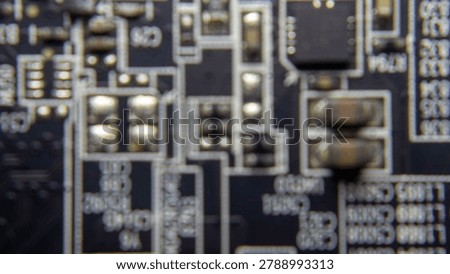 Soft focus blur of advanced GPU electronic circuit board featuring abstract semiconductor patterns and modern digital hardware design.