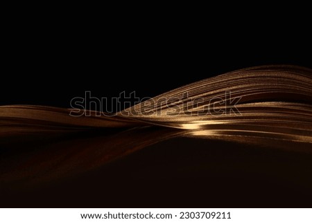 Soft focus blur Gold (bronze) paper wave on black. Abstract backgound. ストックフォト © 