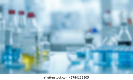A soft focus, blurred background image of a laboratory setting featuring an array of scientific glassware, including test tubes and bottles filled with blue and yellow solutions.
