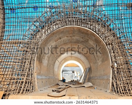 Soft focus and blurred lighting background of focus at railway.Engineer or technician control. Underground tunnel infrastructure. Transport pipeline by Tunnel Boring Machine for electric train subway.