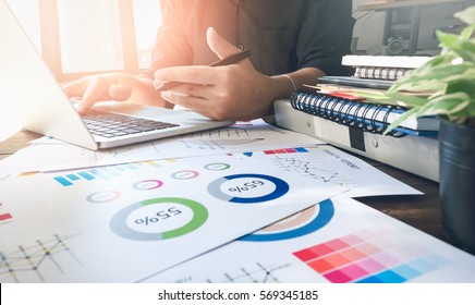 soft focus of businessman hand working laptop on wooden desk in office in morning light. vintage effect - Shutterstock ID 569345185