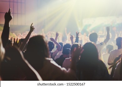 soft focus of Christian worship with raised hand,music concert