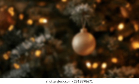A soft focus, close-up view of a decorated Christmas tree featuring golden baubles and twinkling warm lights, creating a festive and cozy atmosphere.