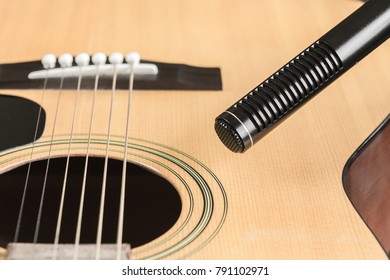 Soft Focus Of Condenser Microphone With Blurred Acoustic Guitar In Vintage Tone. Music And Sound Record Concept.