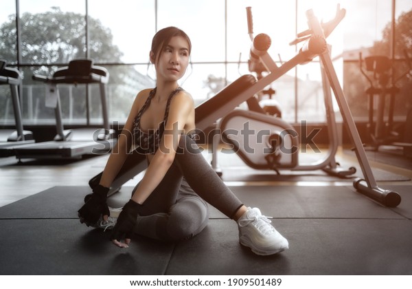 Soft focus consept women are exercising in gym fitness.\
Beautiful women in good shape from taking care of their bodies.\
Health concept. 
