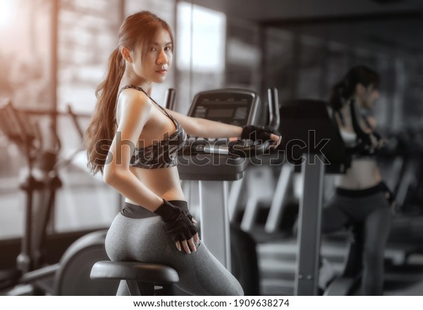 Soft focus consept women are exercising in gym fitness.\
Beautiful women in good shape from taking care of their bodies.\
Health concept. 