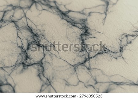 Soft focus dark blue webbed vein fibers on cream color paper