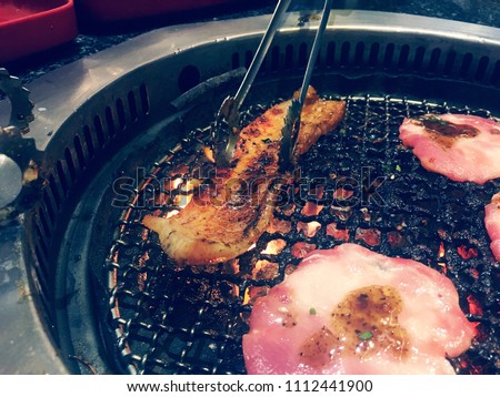 Soft focus of dirty and burnt beef for barbecue grill. Risk factor of cancers. Unhealthy food. Full of foods stains on barbecue grill grates. Carcinogen. Acrylamide from grilling food cause of cancer.