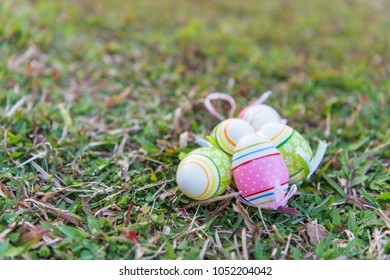 Soft Focus Easter Eggs in Meadow Against Blurred Grass Background,holidays concept