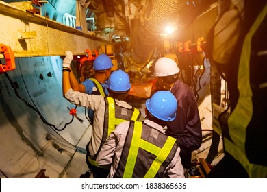 Soft Focus Of Engineers Wear Helmet,vests Safety .Technician Control Underground Tunnel Construction At Working Shaft To Maintenance.Transport Pipeline By Tunnel Boring Machine(TBM) Method For Train.