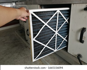Soft Focus to Filter of Air handing Unit, Technician checking a Pre-filter of air handling unit for replacement a new filter - HVAC maintenance