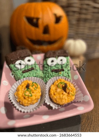 Soft Focus Image Of A Carved Pumpkin In Background With Sweet Treats On A Plate. A Halloween Themed Image