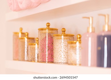 Soft focus image of elegant spa interior with golden jars, natural decor and warm light. Luxury wellness and relaxation atmosphere for beauty and self-care.