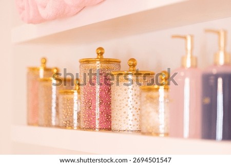 Soft focus image of elegant spa interior with golden jars, natural decor and warm light. Luxury wellness and relaxation atmosphere for beauty and self-care.