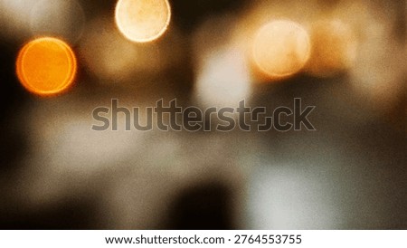 Soft focus image featuring warm glowing circular bokeh lights creating an abstract and atmospheric background