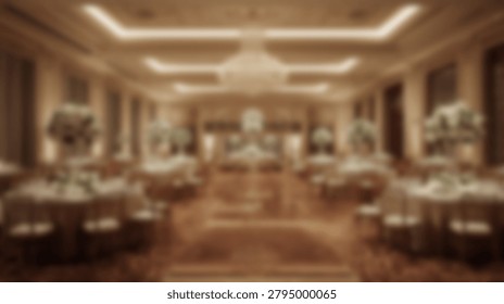 A soft focus interior shot of a spacious banquet hall featuring arranged dining tables and decorative floral arrangements in a warm toned luxury setting