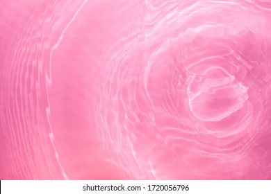 Soft Focus Lite Purple Pink Rose Cosmetic Moisturizer Floral Water, Micellar Toner, Or Emulsion Abstract Background. Reflections Of  Scattered Sun Texture.