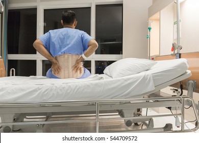 Soft Focus A Male Patient Has Spine Injury Or Fracture Spine, Post Operative On The Bed In Hospital Ward Room.