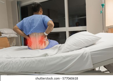 Soft Focus A Male Patient Has Spine Injury Or Fracture Spine, Post Operative On The Bed In Hospital Ward Room.