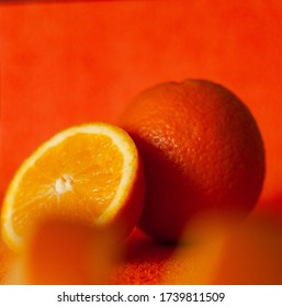 Soft Focus Of Monochromatic Food Composition With Raw Whole And Cut Juicy Oranges On Texured Background