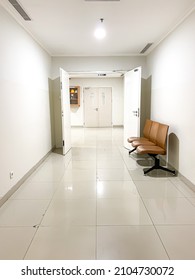 Soft Focus And Noisy Concept Waiting Room In A Hospital, With A Brown Waiting Chair On The Right