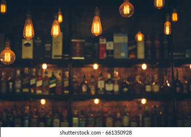 Soft focus picture of vintage lamps with blurred liquor bar in Vintage photo filter style. - Shutterstock ID 661350928