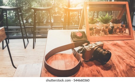 soft focus Place the camera on the table in Background coffee shop - LOFT style for holidays . Customize colors Vintage retro and old film Tone .