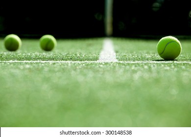 soft focus of tennis ball on tennis grass court