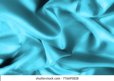 Soft focus. texture, pattern. blue silk fabric. Its deep blue flicker with a white overtones create a bit of romance and mystery, like a film set in Paris. It acts as if it has metal fibers,
