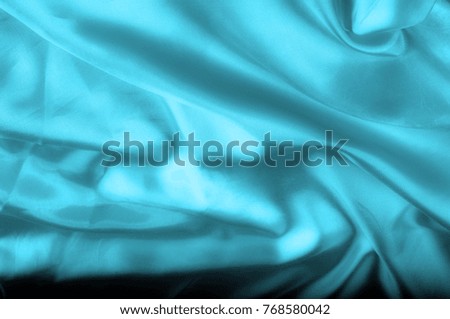 Soft focus. texture, pattern. blue silk fabric. Its deep blue flicker with a white overtones create a bit of romance and mystery, like a film set in Paris. It acts as if it has metal fibers,