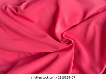 Soft Focus Texture Of The Silk Fabric. Hot Pink Fabric Background.  Crumpled Magenta Color Satin Texture . Fuschia Wavy Textile Background.