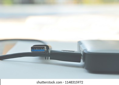 Soft focus of usb cable connect harddisk and laptop computer new technology concept