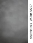 A soft focus view of a hazy gray background.