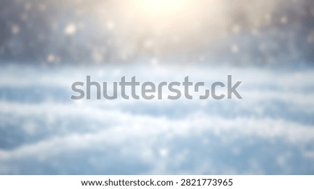A soft focus winter scene featuring a snowy field with bokeh light effects and falling snowflakes under a bright sun.