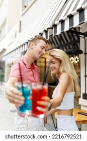 Soft Focus Young Couple Outdoor Bar ,drinking Cocktails Or Lemonade