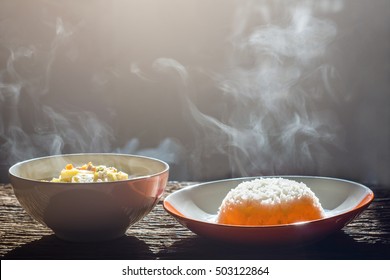 Soft Focus.Bowl Of Hot Food With Steam On Dark Background. Vintage Tone