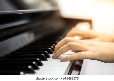 soft focus.musician hands playing piano on piano keyboard.concept for live music festival.Instrument on stage,classical music.abstract musical background.